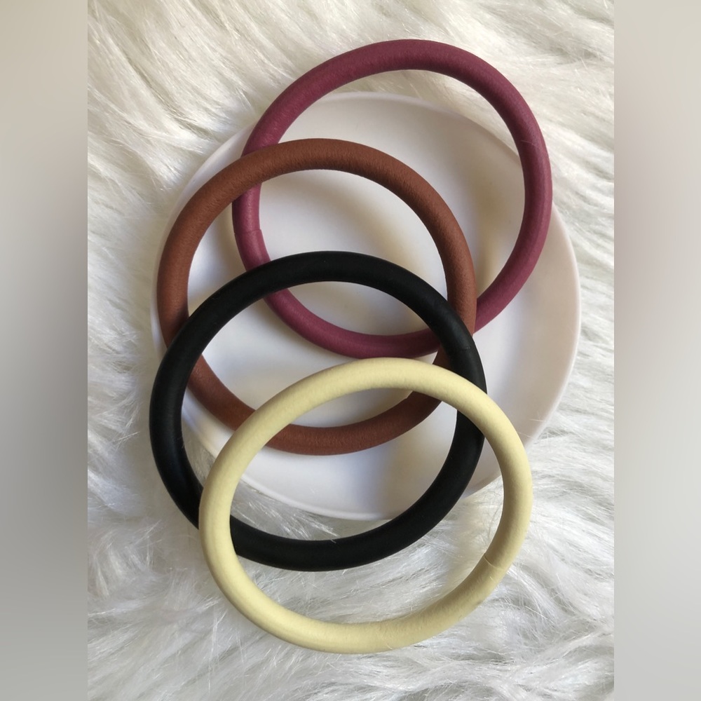 Four stretchy rubber bangle bracelets